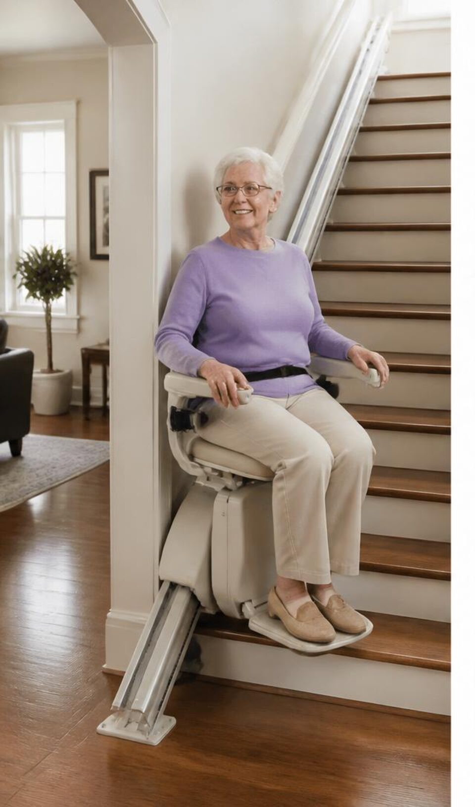Older woman riding a straight stairlift in a bright home