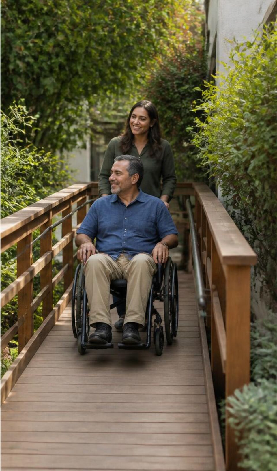 Wheelchair user moving comfortably along a residential ramp